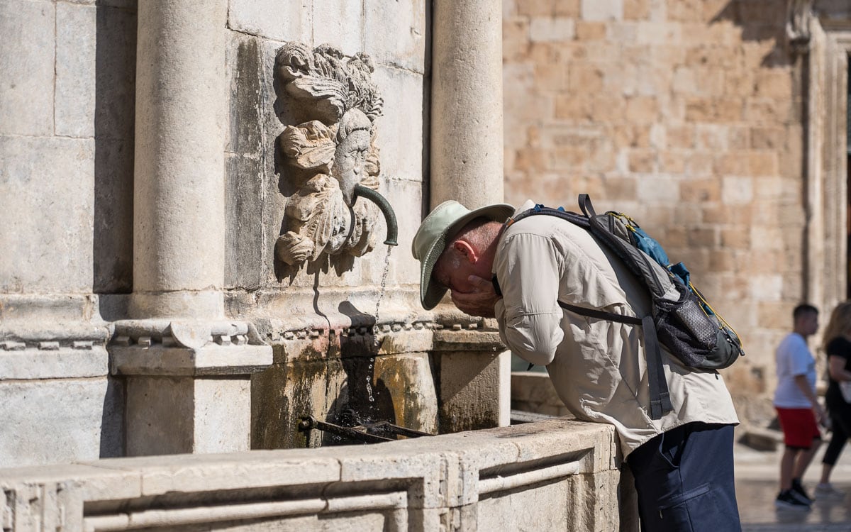 Drinking out of the fountain, Large Onofrio Fountain, Dubrovnik, Croatia